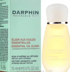 Gesichtsöl mit goldfarbenen Blütenblättern und beruhigendem Vetiver